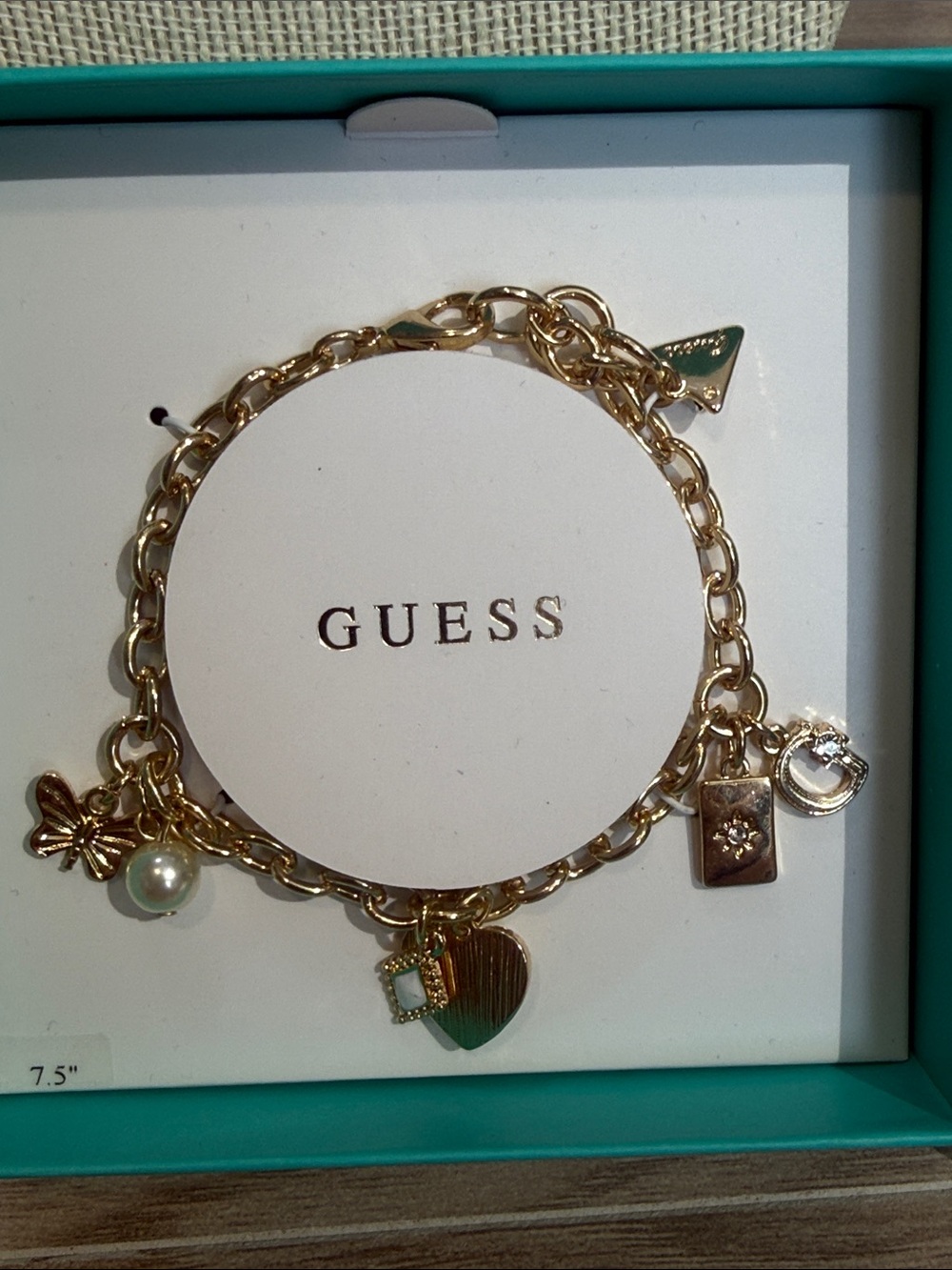 GUESS Gold-Tone Charm Bracelet with Pearl and Heart Charms